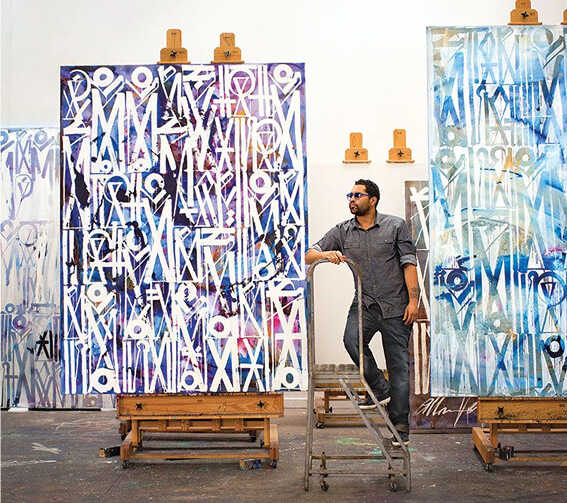 RETNA studio with acrylic works on canvas