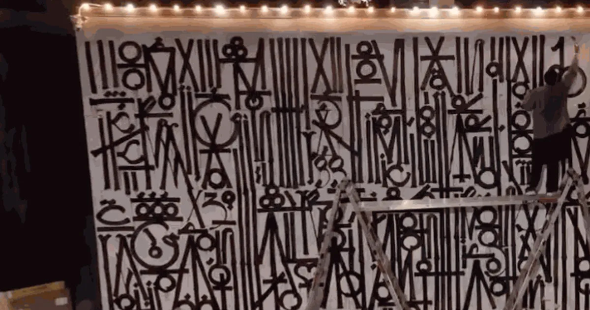 RETNA's gold calligraphic mural at Craig's West Hollywood